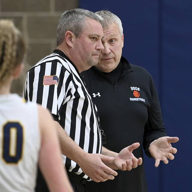 Burrell coach Shaun Reddick talks with an official during a game against Shady Side Academy on Jan. 4, 2024. (Christopher Horner | TribLive)
