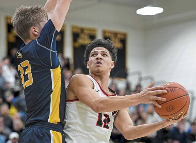 New Castle’s Kai Cox (12) attempts a shot against pressure from Mt. Lebanon’s Samuel Deibert (13) in the WPIAL Class 6A semifinals last season. (Andrew Palla | For TribLive)