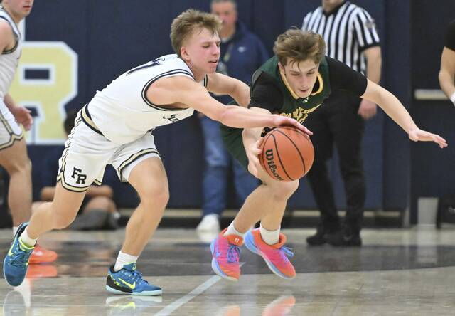 Franklin Regional’s Logan Walter steals the ball from Penn-Trafford’s Orlando DeOrio on Friday. (Chaz Palla | TribLive)