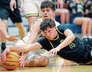 Deer Lakes’ Luca Mangieri (4) fights for the ball against Freeport on Friday. (Josh Rizzo | For TribLive)