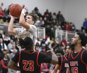 South Allegheny’s Drew Cook drives over Aliquippa’s Cleaster Longmire IV during the PIAA Class 3A semifinals March 22. (Chaz Palla | TribLive)