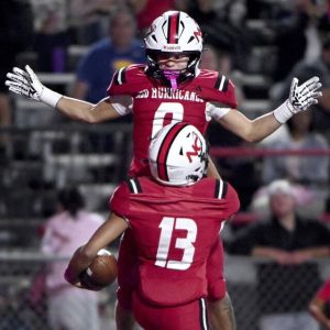 New Castle’s ChaseLemmon celebrates with quarterback Marino Graham after Graham’s second touchdown against Montour on Friday, Oct. 3, 2025, at Taggart Stadium. (Christopher Horner | TribLive)