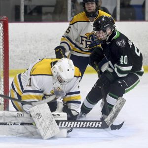 Franklin Regional goalie Grant Novotny makes a save on Pine-Richlands Michael Desjardins during their game on Monday, Nov. 10, 2025, Palmer Imaging Arena in Delmont. (Christopher Horner | TribLive)