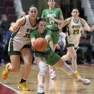 South Fayettes Ryan Oldaker grabs a loose ball in front of Archbishop Woods Emily Knouse during the PIAA Class 5A championship game on Saturday, March 29, 2025, at Giant Center in Hershey. (Christopher Horner | TribLive)