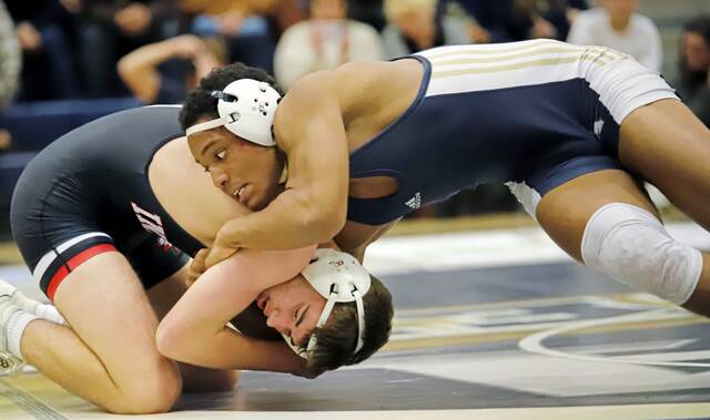 Kiski Areas Abrahm Taylor looks for an opening for a takedown during his 172-pound bout against Indianas Domenic Donatelli on Dec. 10. (Josh Rizzo | For TribLive)