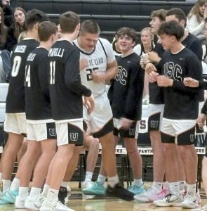 Ryan Robbins is introduced as a member of the starting lineup for Upper St. Clair against Canon-McMillan on Tuesday. (Don Rebel | TribLive)