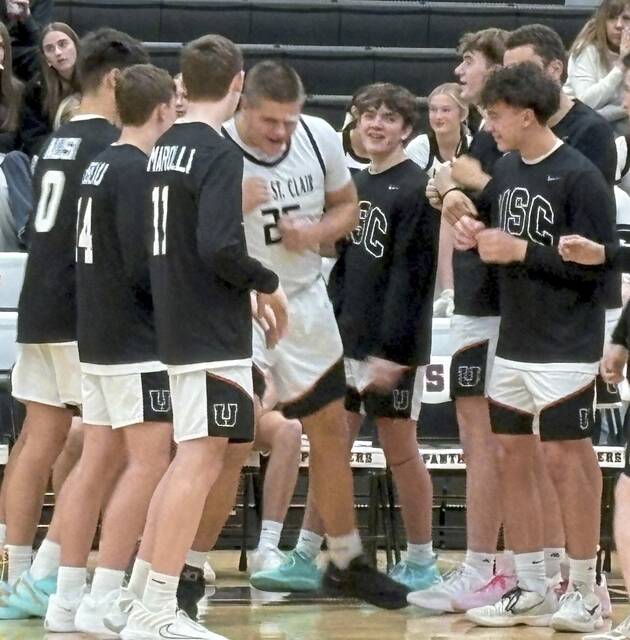 Ryan Robbins is introduced as a member of the starting lineup for Upper St. Clair against Canon-McMillan on Tuesday. (Don Rebel | TribLive)