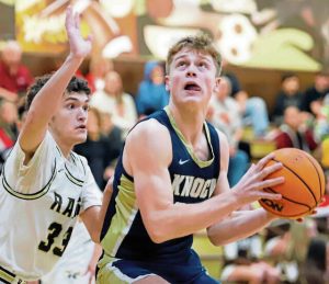 Highlands Brayden Spiering (left) attempts to guard Knochs Liam Avon on Friday at Highlands High School. (Josh Rizzo | For TribLive)