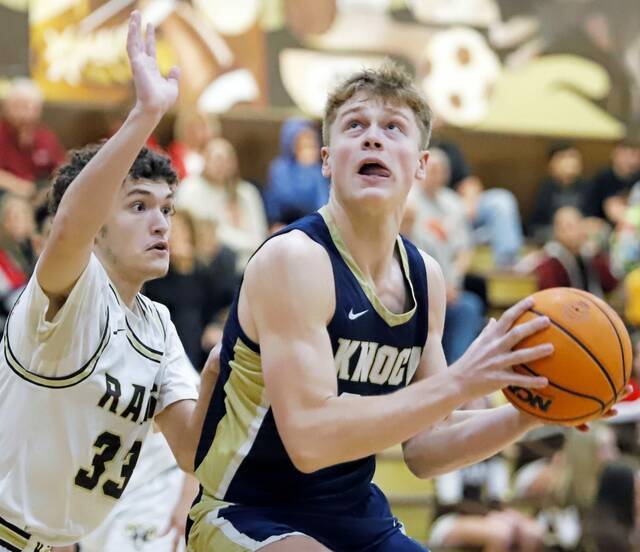 Highlands Brayden Spiering (left) attempts to guard Knochs Liam Avon on Friday at Highlands High School. (Josh Rizzo | For TribLive)