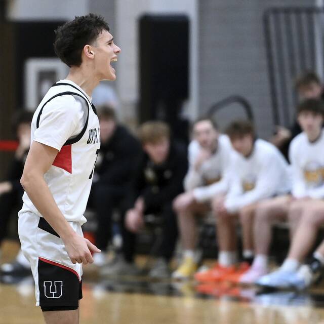 Upper St. Clairs Jake Foster celebrates a 3-pointer against Norwin on Dec. 9. (Christopher Horner | TribLive)