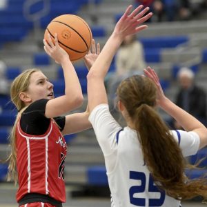 North Hills Zoe Devlin scores against Hempfields Gabby Coccia earlier this month. The Indians entered the WPIAL Class 6A rankings this week. (Christopher Horner | TribLive)