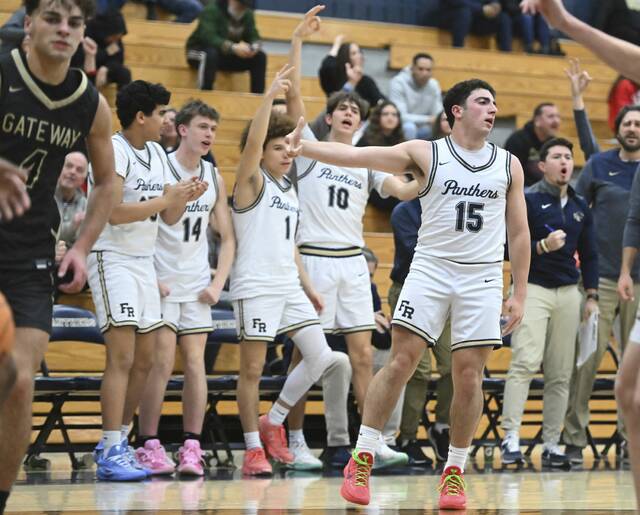 Franklin Regionals bench celebrates Anthony Mitchells 3-pointer against Gateway on Dec. 19, 2025 at Franklin Regional High School. (Chaz Palla | TribLive)