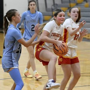 North Catholic’s Finley O’Shea pulls down a rebound next to Burrell’s Chase Coury on Monday, Dec. 22, 2025, in Cranberry. (Christopher Horner | TribLive)
