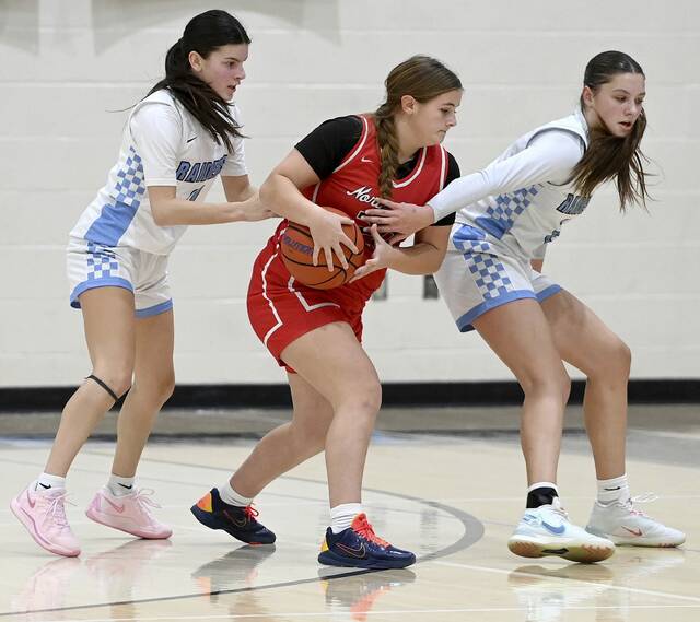 North Hills’ Emma Culver battles Seneca Valley’s Taylor Dixon and Reece McFadden for possession on Monday, Dec. 22, 2025, in Jackson. (Christopher Horner | TribLive)