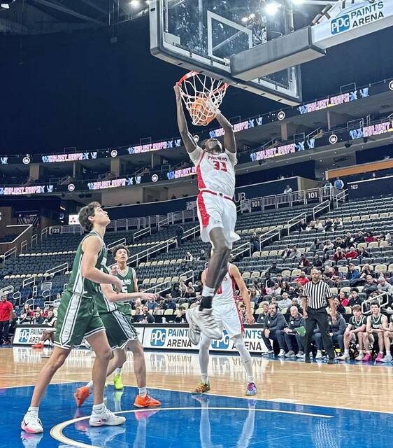 Sewickley Academy's Adam Ikamba dunks against Pine-Richland in the Pittsburgh Holiday Classic on Monday, Dec. 22, 2025 at PPG Paints Arena. (Antonio Rossetti | For TribLive)