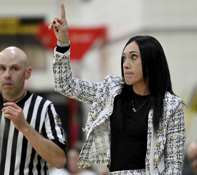 Latrobe coach Mackenzie Livingston calls a play from the bench Dec. 16 at Penn-Trafford. (Christopher Horner | TribLive)