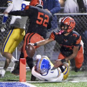 Clairton quarterback Jeff Thompson reaches for the end zone during the Bears PIAA Class A state semifinal against Greenville on Nov. 28, 2025, at Helling Stadium in Ellwood City. (Christopher Horner | TribLive)