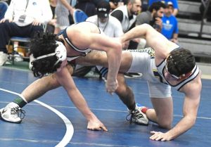 Norwins Landon Sidun (right) tries to escape a takedown attempt by Christian Brothers Academys Paul Kenny in the 121-pound final at the 2024 Powerade Tournament at Canon-McMillan. (Paul Schofield | TribLive)