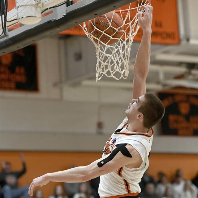 Latrobe’s Ian Decerb dunks against Penn-Trafford on Tuesday, Dec. 23, 2025, at Latrobe. (Christopher Horner | TribLive)
                                Latrobes Ian DeCerb dunks against Penn-Trafford on Tuesday. (Christopher Horner | TribLive)