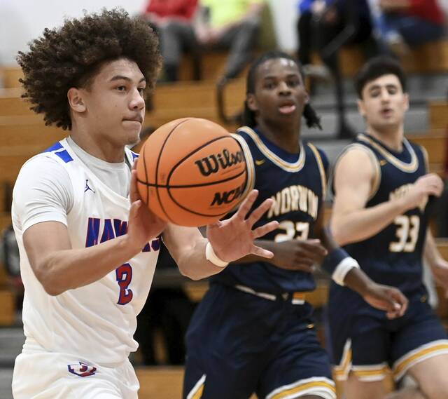 Jeannette’s Jayce Powell passes on a fast-break against Norwin on Saturday, Dec. 20, 2025, at Jeannette. (Christopher Horner | TribLive)