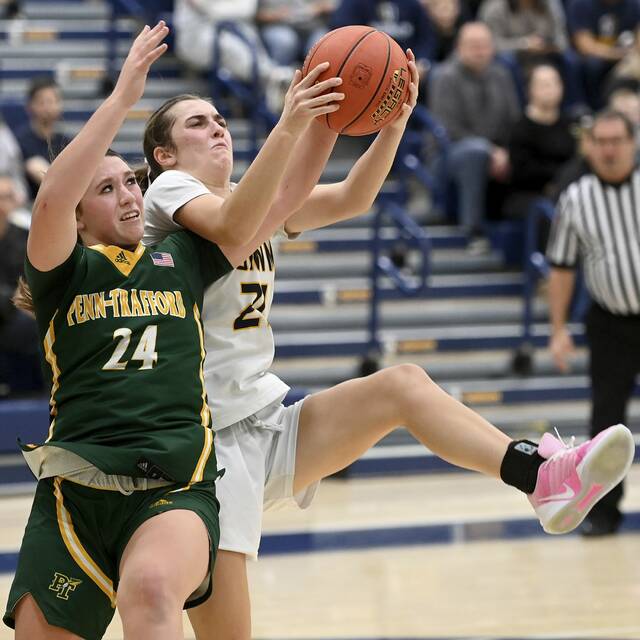 Norwin’s Liz Yarosik battles Penn-Trafford’s Torrie Destefano for a rebound during their game on Dec. 2, 2025, at Norwin. (Christopher Horner | TribLive)
