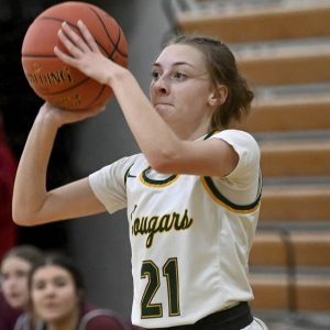 Blackhawks Grace Huston shoots a 3-pointer against Beaver last season. (Christopher Horner | TribLive)
