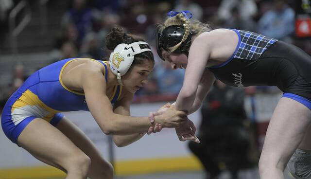 Cannon McMillion Marlee Solomon Wrestles Connect Area, Daylee Watson, in the 112 pound Championship match during the PIAA Class wrestling tournament Saturday, March 8, 2025, at Giant Center in Hershey.
                                Canon-McMillans Marlee Solomon (left) won the 118-pound title at the Powerade tournament Sunday. (Louis B. Ruediger | TribLive)