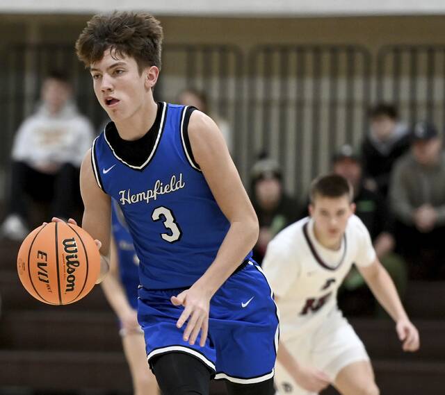 Hempfields Lucas Simmons breaks upcourt after a steal against Greensburg Central Catholic on Monday at Greensburg Salem. (Christopher Horner | TribLive)