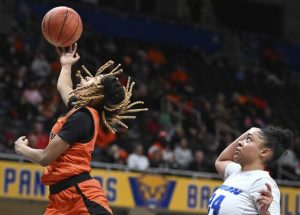 Clairtons Iyanna Wade scores past Unions Miera Gunn during the WPIAL Class A championship game Feb. 28 at Petersen Events Center. (Chaz Palla | TribLive)