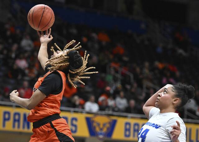 Clairtons Iyanna Wade scores past Unions Miera Gunn during the WPIAL Class A championship game Feb. 28 at Petersen Events Center. (Chaz Palla | TribLive)