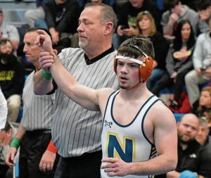 Norwin junior Landon Sidun has his hand raised after winning the 121-pound title Tuesday at the Powerade tournament. (Paul Schofield | TribLive)