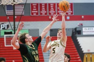 Norwin’s Alex Graney (5) shoots as Belle Vernon's Dane Daugherty defends Tuesday, Dec. 30, 2025 at the Peters Township holiday tournament. (Jeff Helsel | Mon Valley Independent)