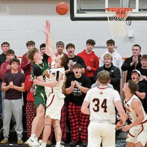 Penn-Traffords Nick Ponko scores the winning basket over Latrobes Ian DeCerb in the final seconds Tuesday at Latrobe. (Christopher Horner | TribLive)