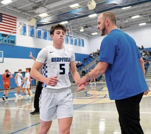 Hempfield coach Austin Butler talks with Trevor Donsen against Latrobe last month. (Christopher Horner | TribLive)