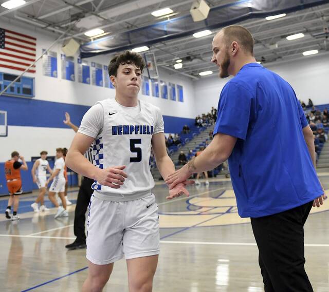 Hempfield coach Austin Butler talks with Trevor Donsen during their game against Latrobe last month. (Christopher Horner | TribLive)