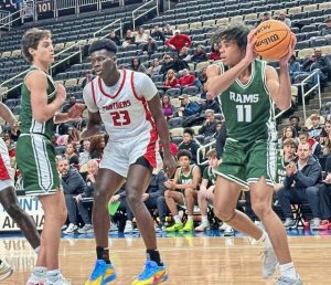 Pine-Richland's Lucien Miller pulls down a rebound against Sewickley Academy at the Pittsburgh Holday Classic on Monday, Dec. 22, 2025 at PPG Paints Arena. (Antonio Rossetti | For TribLive)