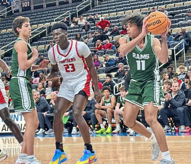 Pine-Richland's Lucien Miller pulls down a rebound against Sewickley Academy at the Pittsburgh Holday Classic on Monday, Dec. 22, 2025 at PPG Paints Arena. (Antonio Rossetti | For TribLive)