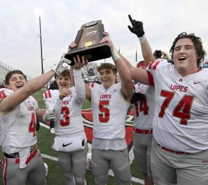 Avonworth captains celebrate after receiving the state championship trophy after defeating Northwestern Lehigh in the PIAA Class 3A final Dec. 6, 2025, at Cumberland Valley. (Christopher Horner | TribLive)