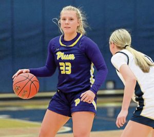 Plums Riley Stephans works against Kiski Areas Jada Blanciak during their game on Monday, Dec. 8, 2025, at Kiski Area. (Christopher Horner | TribLive)