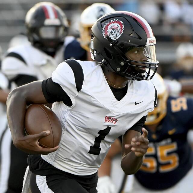 Aliquippa quarterback Marques Council carries against Mars on Friday, Sept. 12, 2025, in Adams. (Christopher Horner | TribLive)