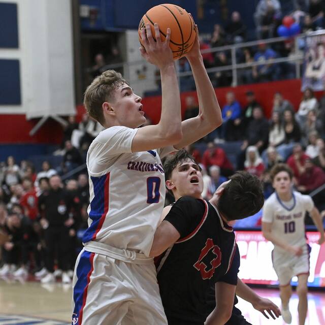 Chartiers Valley’s Luca Federico drives to the basket against Moon on Friday, Dec. 19, 2025, at CV. (Christopher Horner | TribLive)