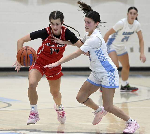 Seneca Valley’s Taylor Dixon battles North Hills’ Sophia Regan for a loose ball on Monday, Dec. 22, 2025, in Jackson. (Christopher Horner | TribLive)
