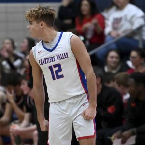 Chartiers Valleys Julian Semplice celebrates a 3-pointer in front of the Moon bench on Dec. 19, 2025. (Christopher Horner | TribLive)