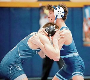 Burrells Julian Bertucci (right) locks up with Penns Valleys Sawyer Fetterolf during a 145-pound bout in the first round of the PIAA Class 2A team tournament last season. (Josh Rizzo | For TribLive)