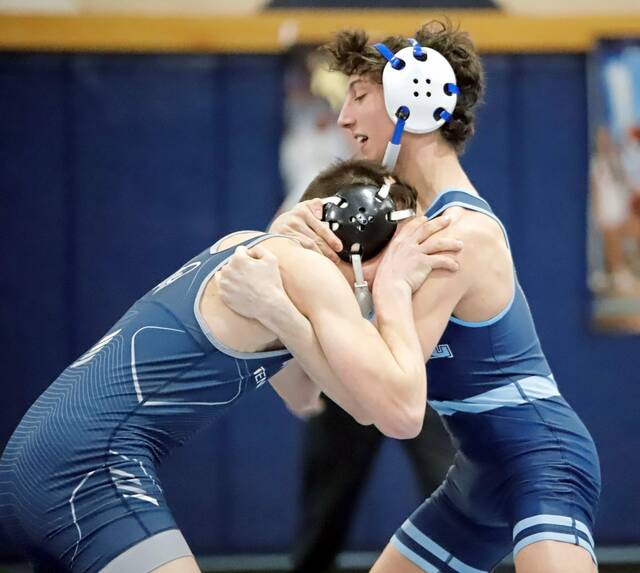 Burrells Julian Bertucci locks up with Penns Valleys Sawyer Fetterolf during a 145-pound bout in the first round of the PIAA Class 2A team tournament last season. (Josh Rizzo | For TribLive)