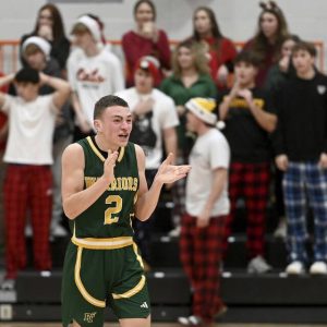 Penn-Trafford’s Ben Lenart celebrates after defeating Latrobe, 67-65, on Tuesday, Dec. 23, 2025, at Latrobe. (Christopher Horner | TribLive)