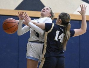 Burrells McKenna Miller drives against Freeports Nia DiSanti on Monday at Burrell High School. (Chaz Palla | TribLive)