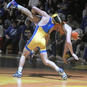 Derrys Will McNeal takes down Latrobes Logan Peagler during the 139-pound match Monday. (Paul Schofield | TribLive)