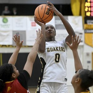 Quaker Valleys Mimi Thiero scores against New Brighton on Jan. 5 at QV. (Christopher Horner | TribLive)