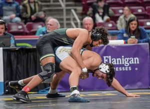 Kiski Areas Cooper Roscosky (bottom) wrestles Elijah Brown in the 215-pound state championship match in March. They could see each other at this weekends WCCA tournament. (Louis B. Ruediger | TribLive)
